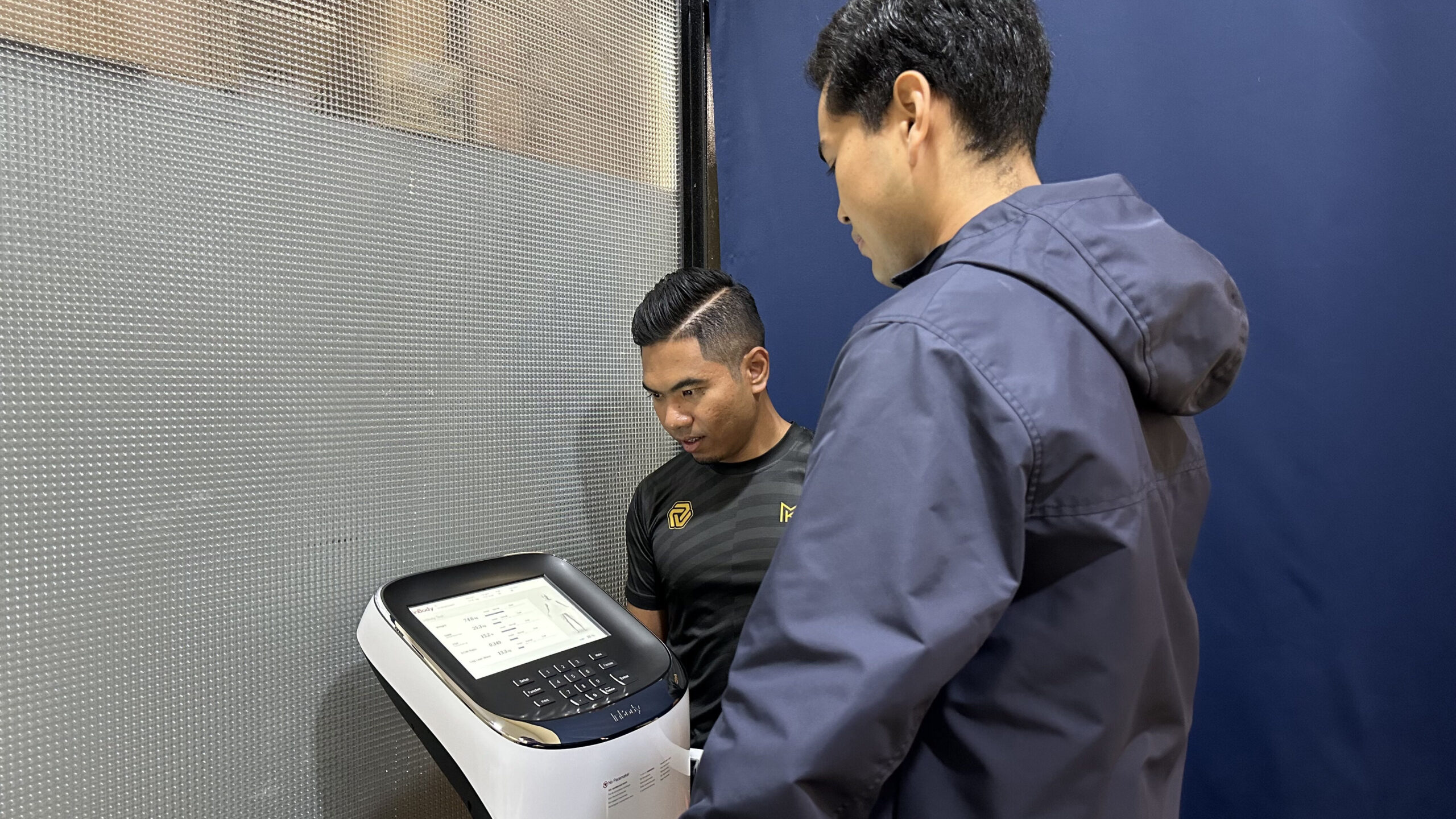 Dr. Suffian assisting his patient in doing the InBody test