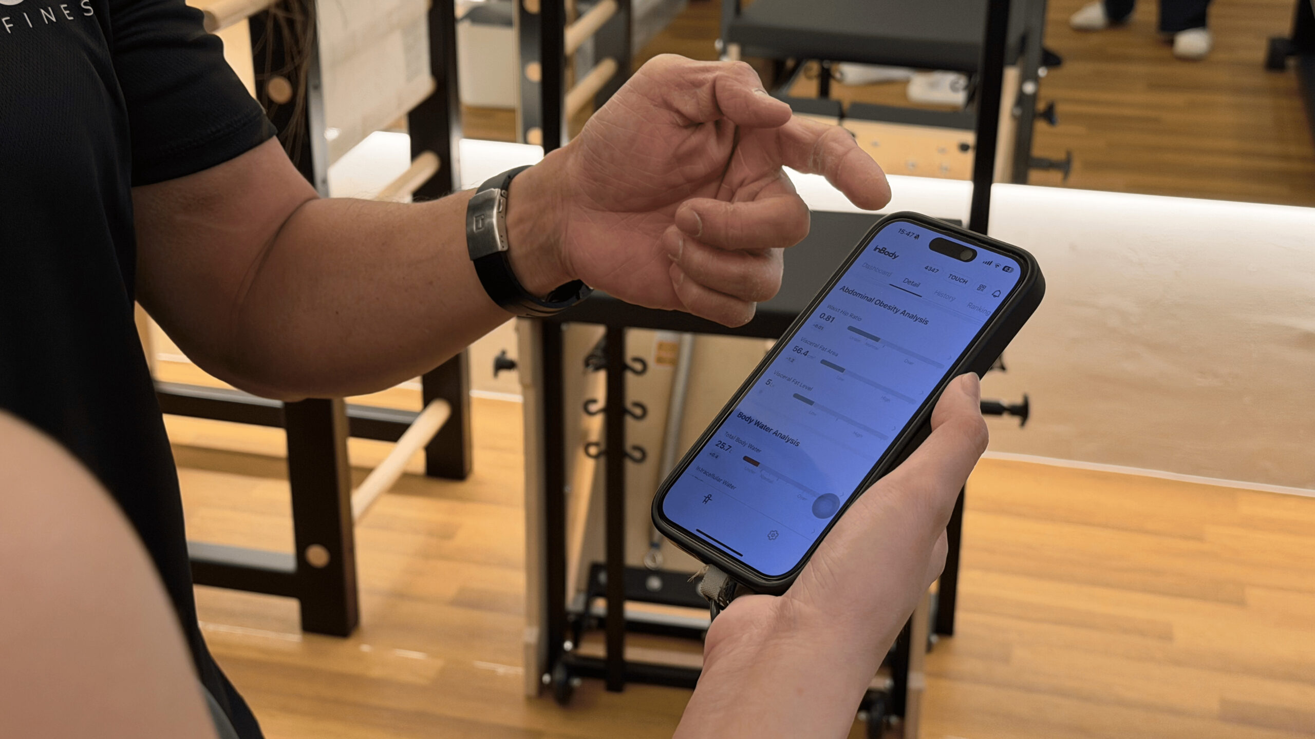 Pilates instructor explaining InBody results on the InBody App